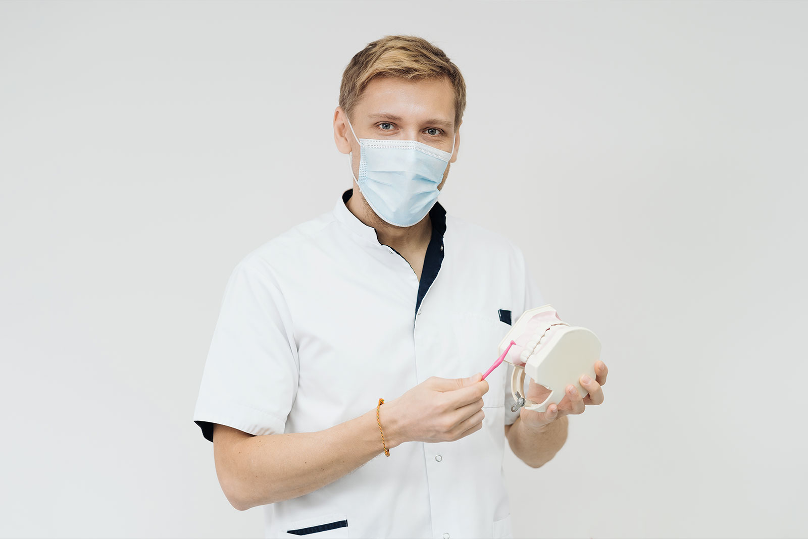 Dental professional in a clinic setting reviewing care information